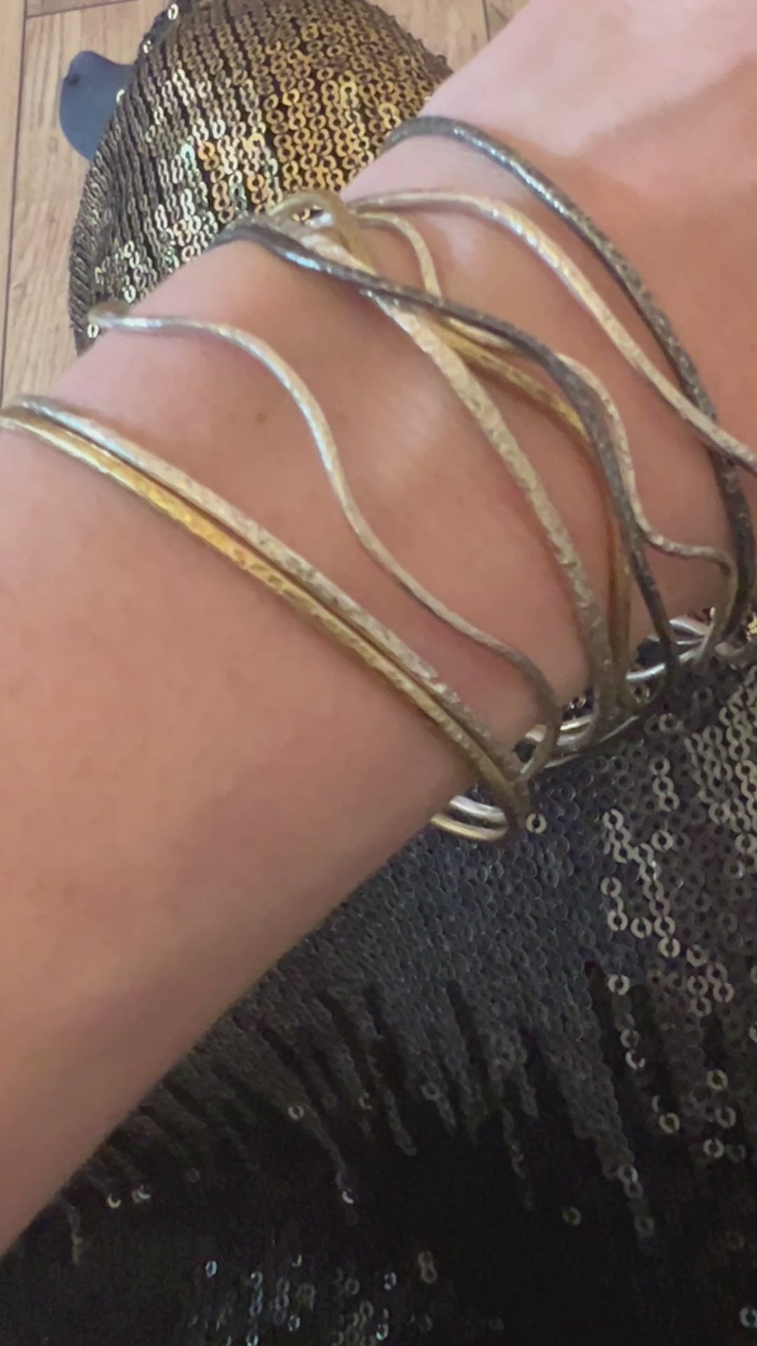 Six elements Goddess collection a set of silver textured bangles on a hand