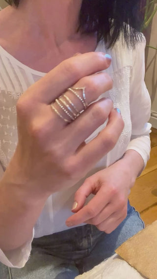 Sterling silver stacking rings set on a hand