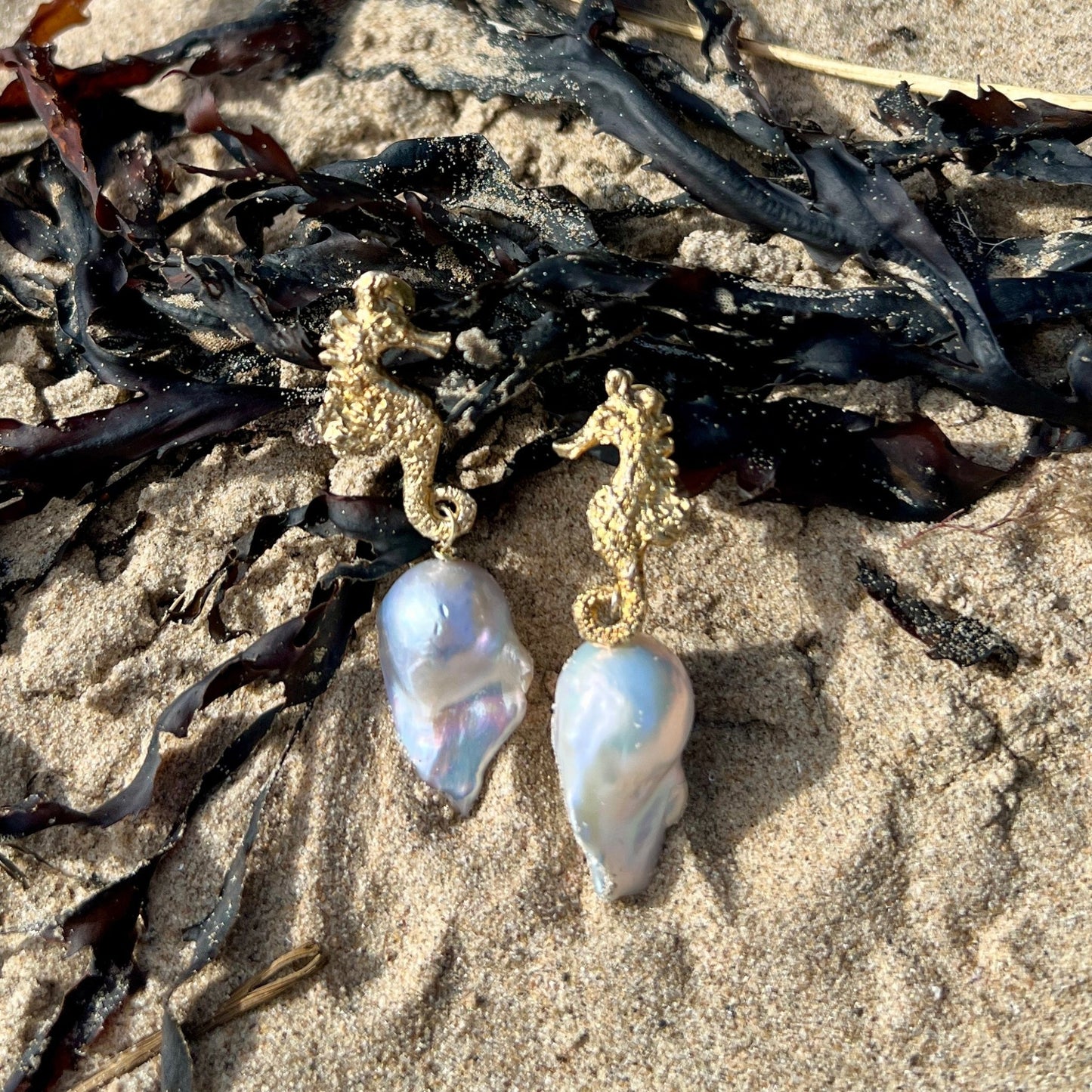 Eternal Pair – Seahorse Pearl Earrings balance and beauty with sculpted silver seahorses, 24ct gold accents, baroque pearls.