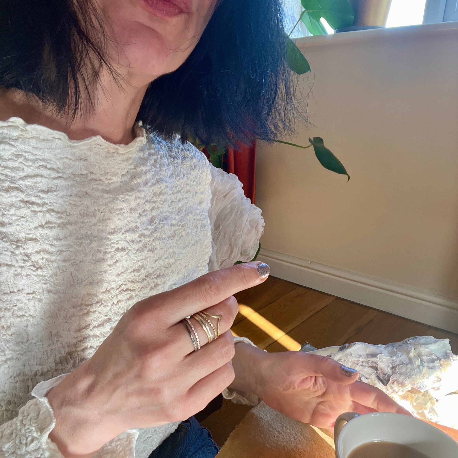 The Rings of Becoming – Stacking Ring Set in Gold and Silver worn on a hand - 6 elements Studio