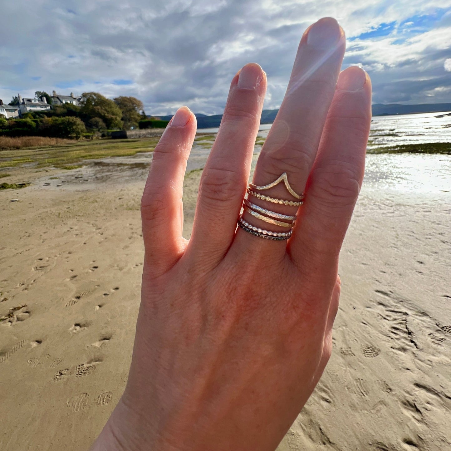 The Rings of Becoming – Stacking Ring Set in Gold and Silver worn on a hand - 6 elements Studio