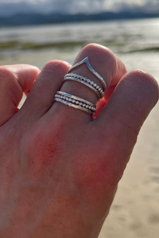 The Rings of Becoming – Stacking Ring Set in Sterling Silver worn on a hand  - 6 elements Studio
